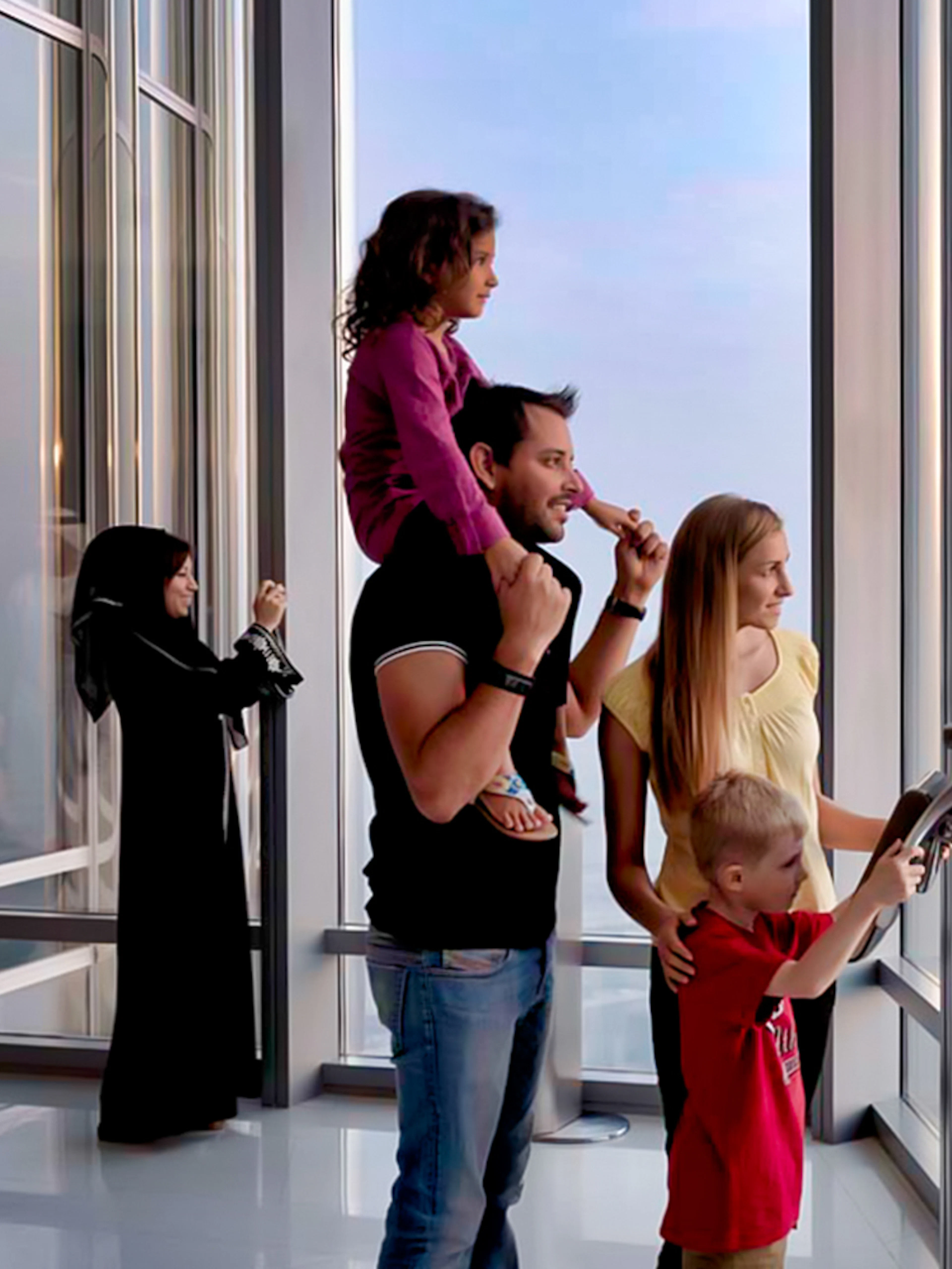 Visitors enjoying the view from Burj Khalifa's Level 124 and 125 observation deck.
