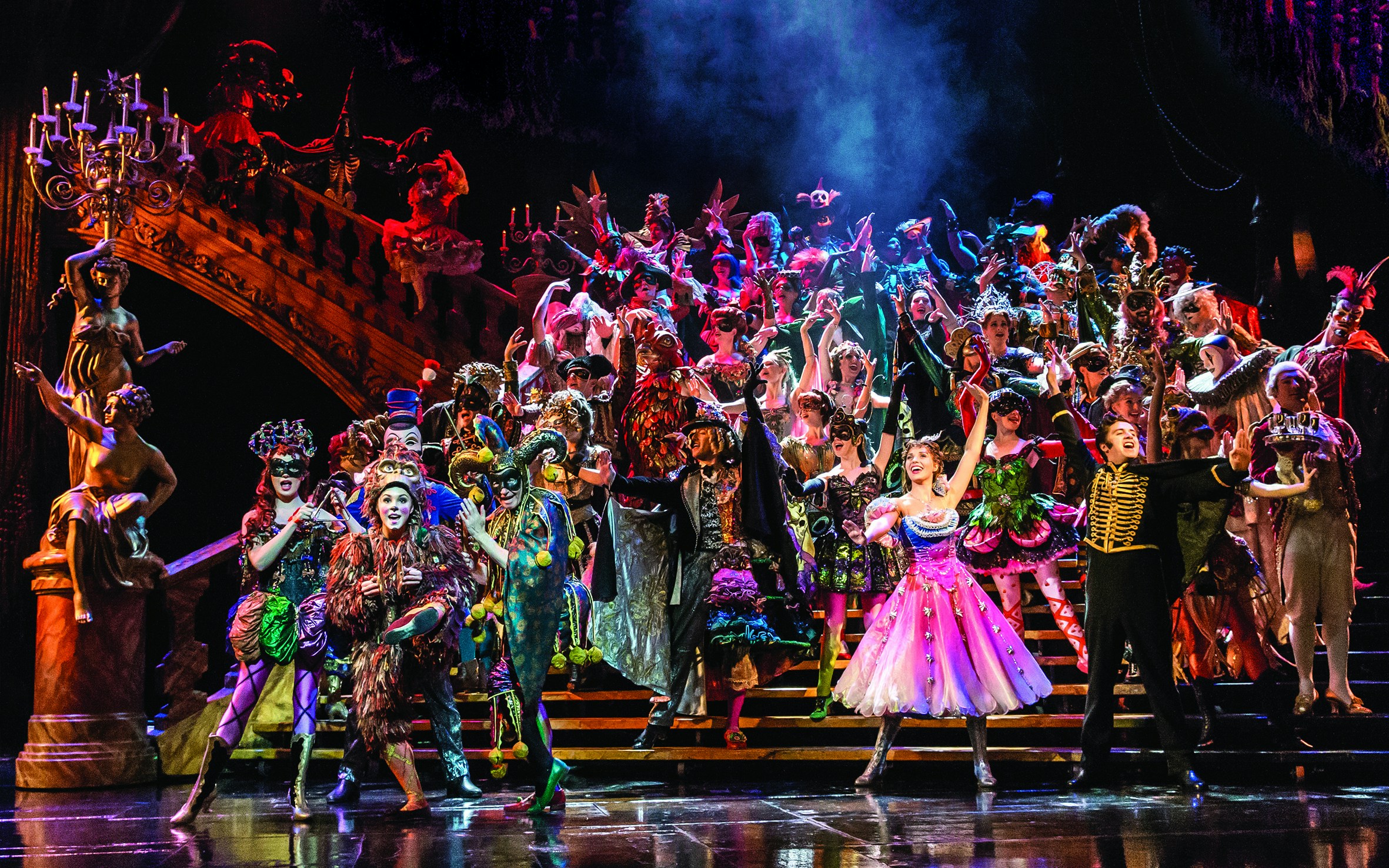Cast performing a vibrant masquerade scene in Phantom of the Opera, West End.