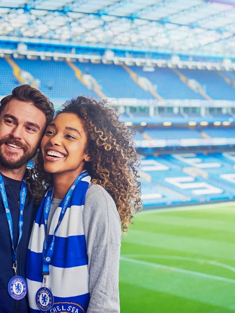 Tourists taking a selfie at Chelsea FC Stadium in London.