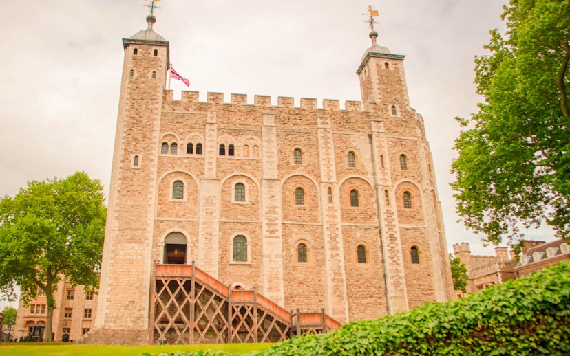 Tower of London White Tower with surrounding greenery, London, England.