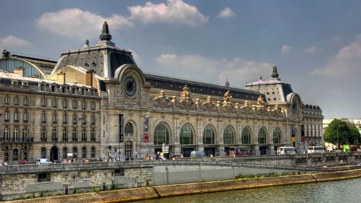 Orsay Museum exterior along the Seine River, Paris, featured in guided tour.