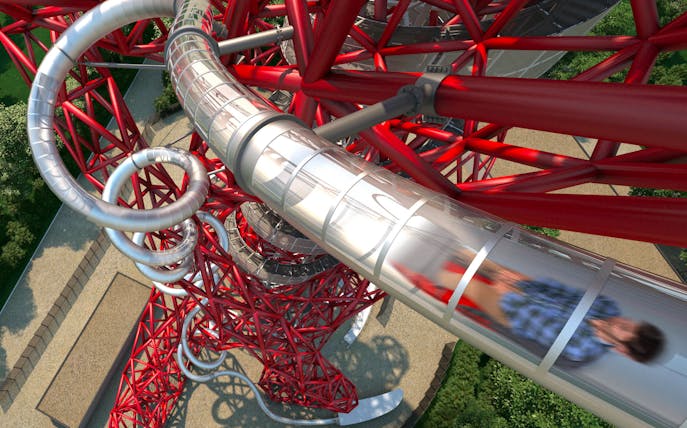 ArcelorMittal Orbit slide with person descending, London skyline views.