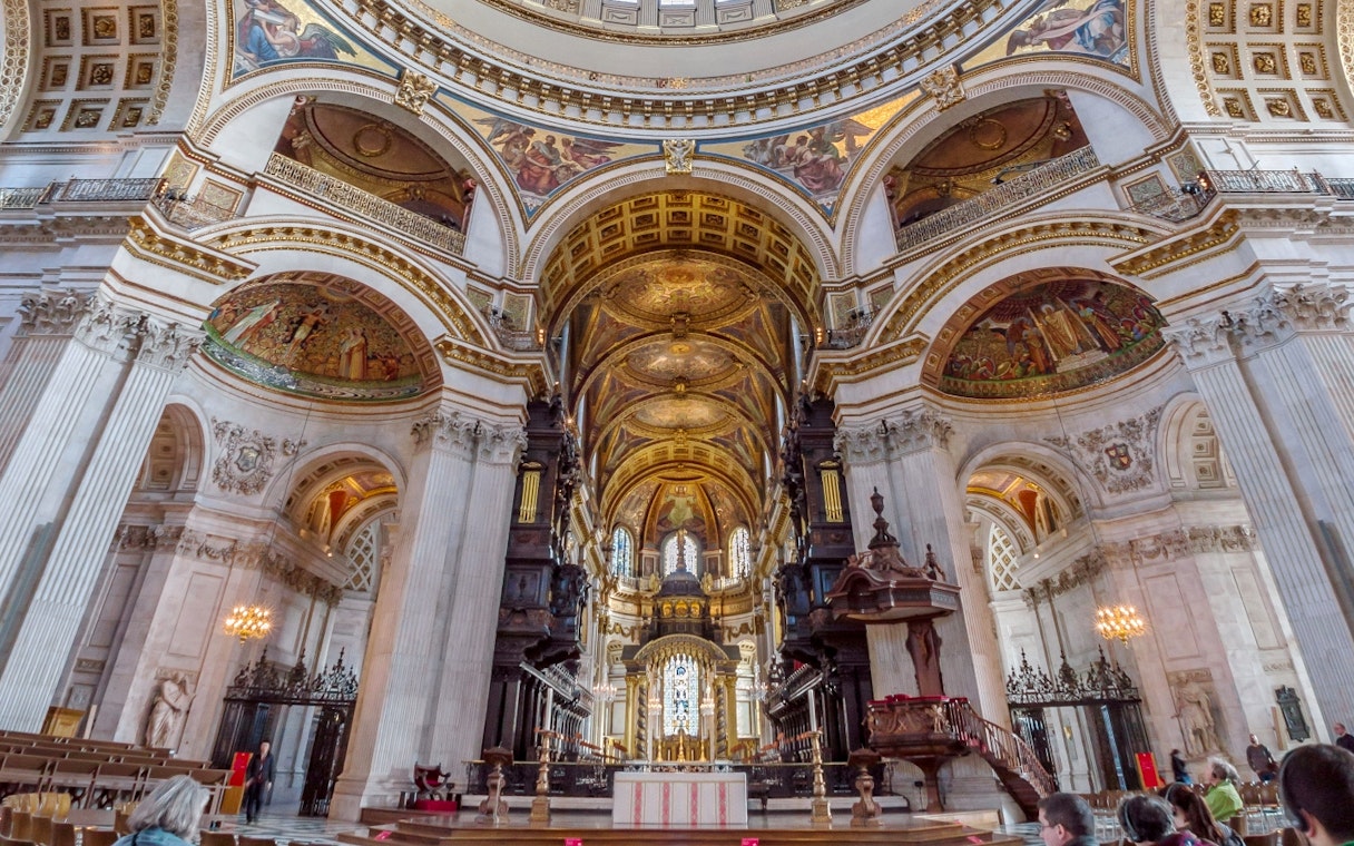 St Paul's Cathedral interior with ornate ceiling and altar, London.