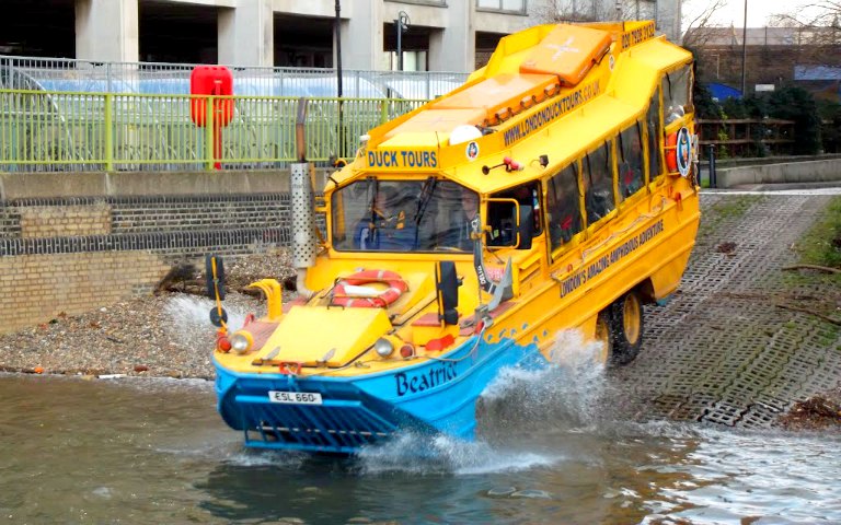 Amphibious vehicle entering water on a London Duck Tour.