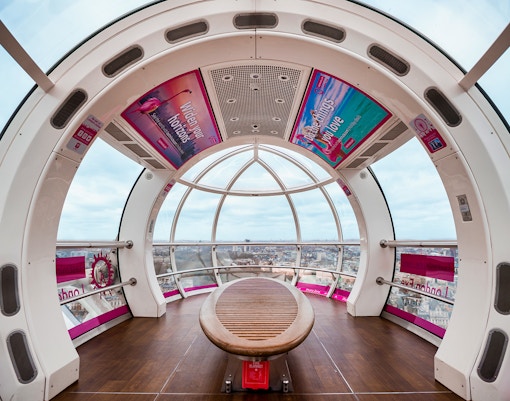 London Eye capsule interior with city view through glass windows.