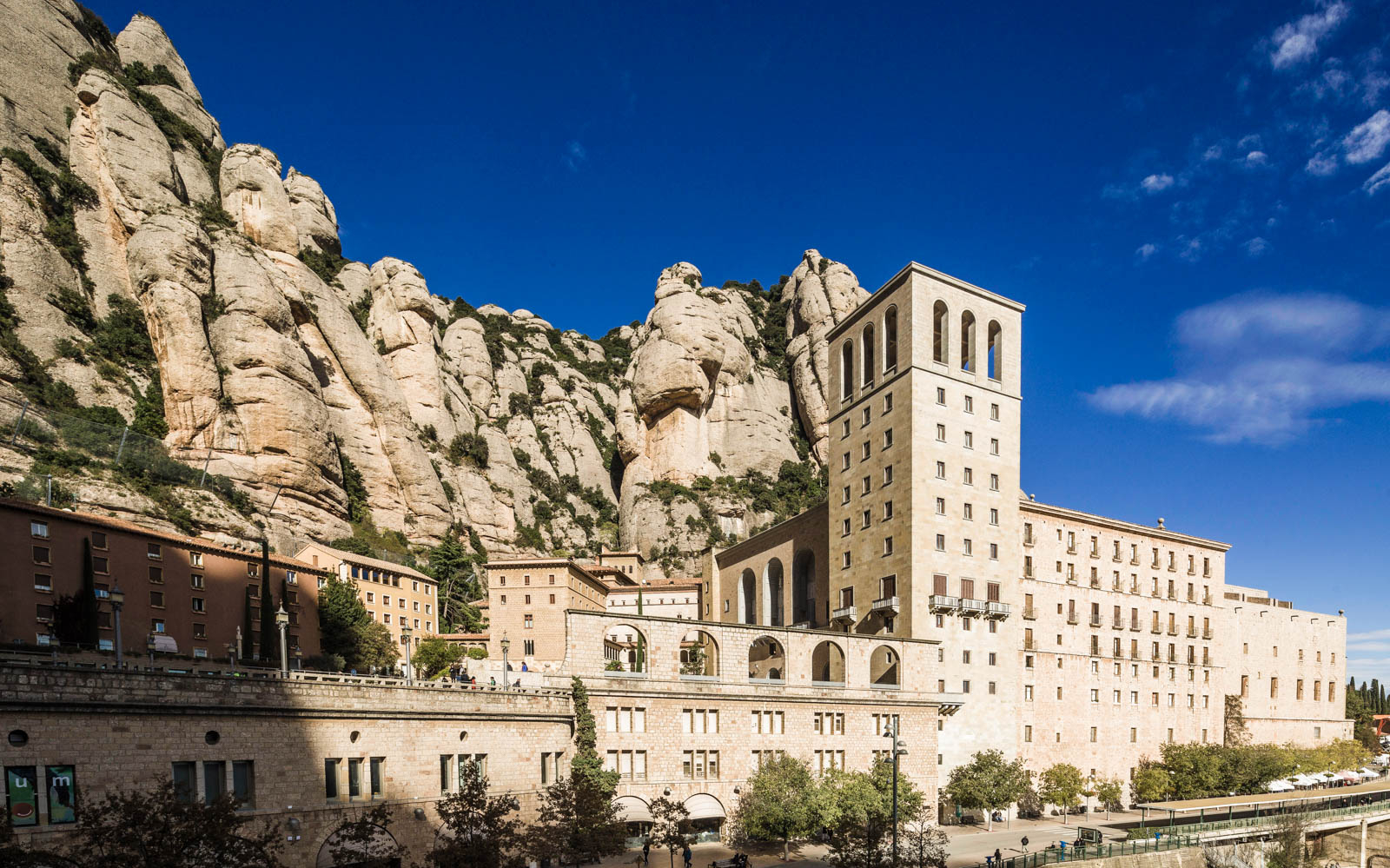 Montserrat Monastery with rocky mountain backdrop, part of Montserrat, Sitges and Torres Wine Tour from Barcelona.