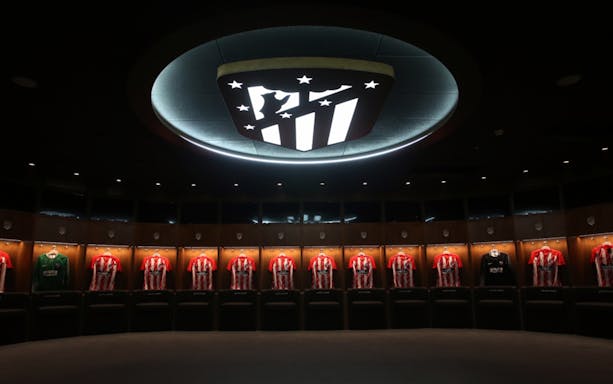 Atlético de Madrid locker room with team jerseys at Cívitas Metropolitano Museum.