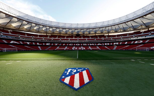 Cívitas Metropolitano Stadium field view with Atlético Madrid logo.