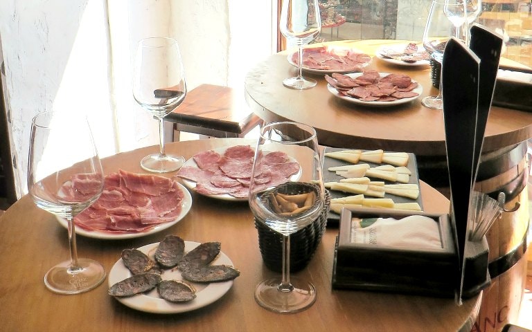 Tapas and wine on a table during Madrid Authentic Tapas & History Tour.