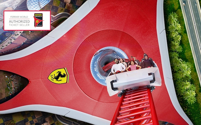 Roller coaster at Ferrari World Abu Dhabi with excited riders.