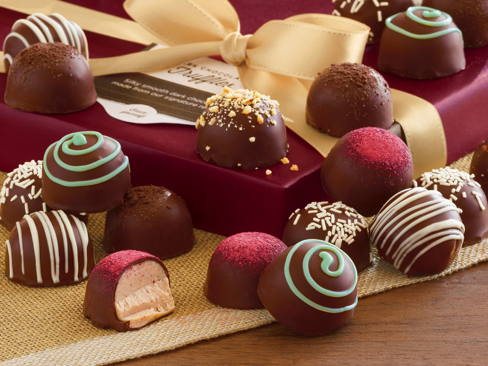 Assorted chocolate truffles on display, part of the Paris walking tour featuring chocolates and pastries.