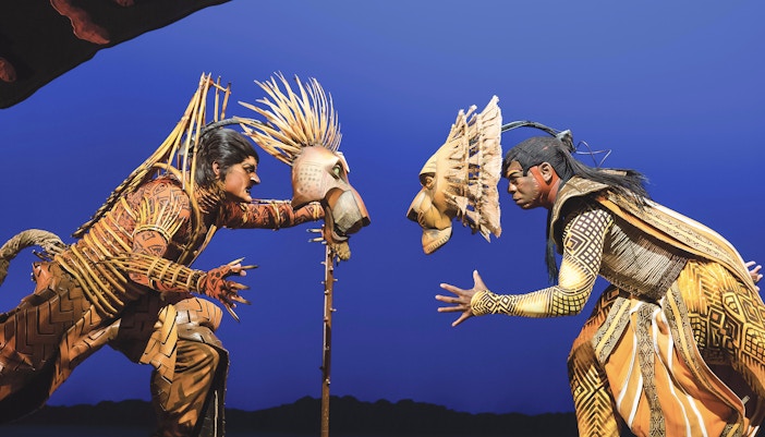 Broadway stage scene from The Lion King musical in New York City.