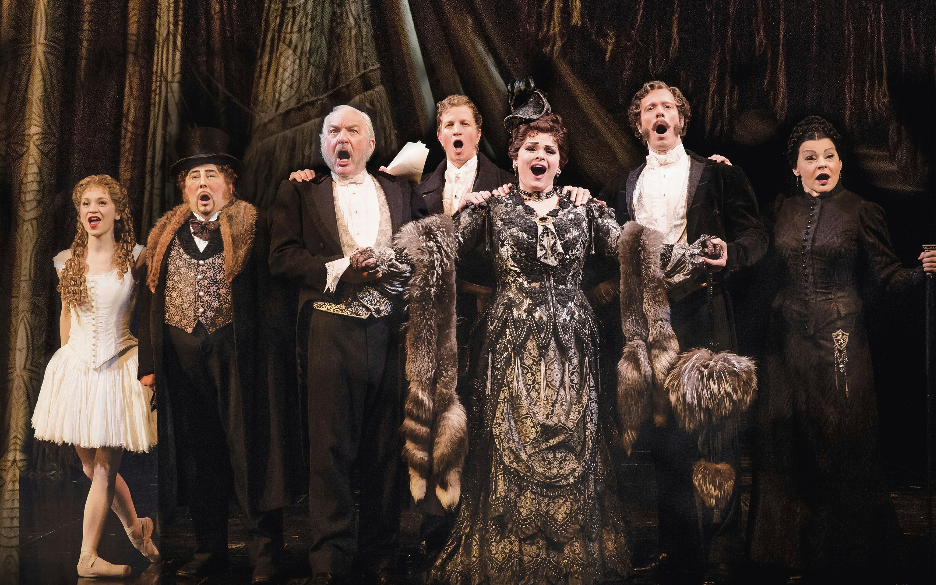 Cast performing on stage in Phantom of the Opera production.