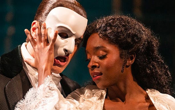 Actors performing a scene from Phantom of the Opera.