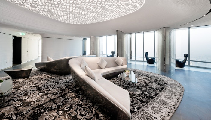 Luxurious lounge area at Armani Hotel, Burj Khalifa, with modern decor and panoramic city views.