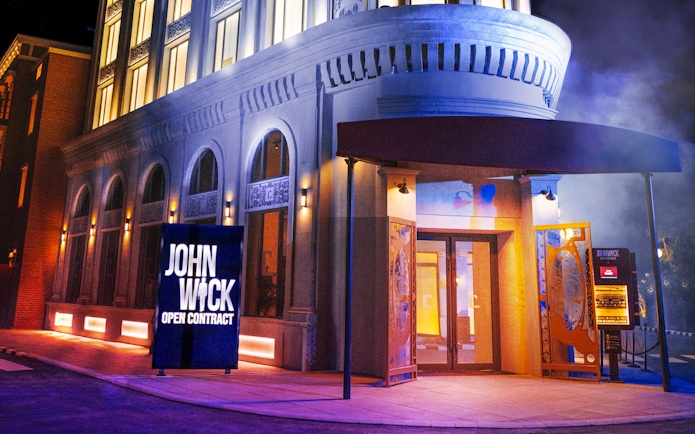 John Wick stunt show entrance at MOTIONGATE Dubai with dramatic lighting.