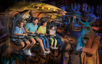 Family enjoying a thrilling ride at MOTIONGATE™ Dubai theme park.
