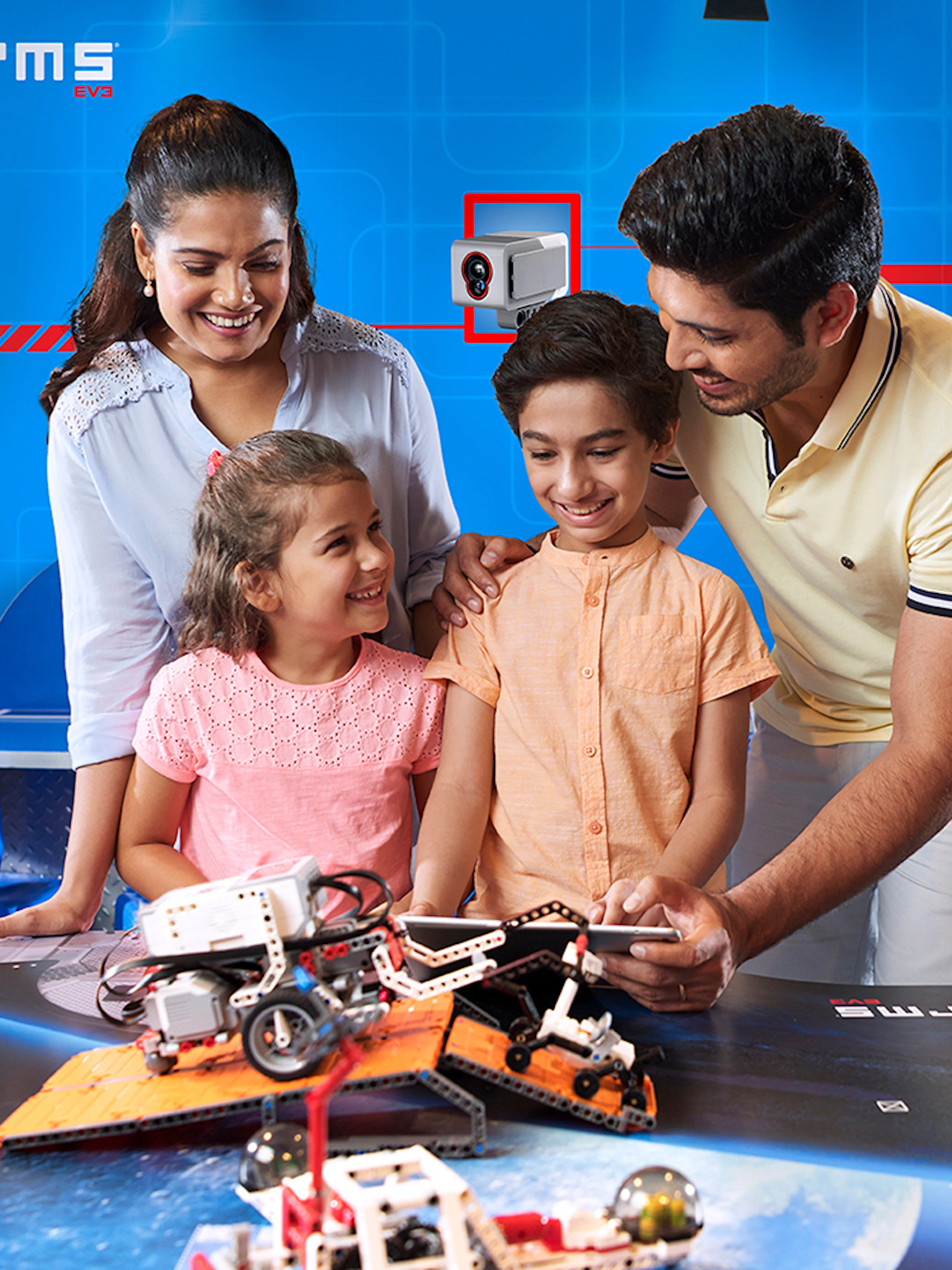 Family exploring robotics at Legoland Dubai.