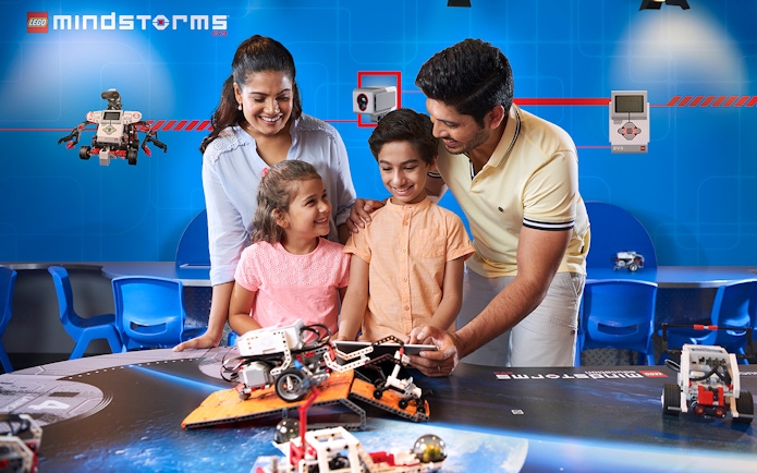 Family exploring robotics at Legoland Dubai.