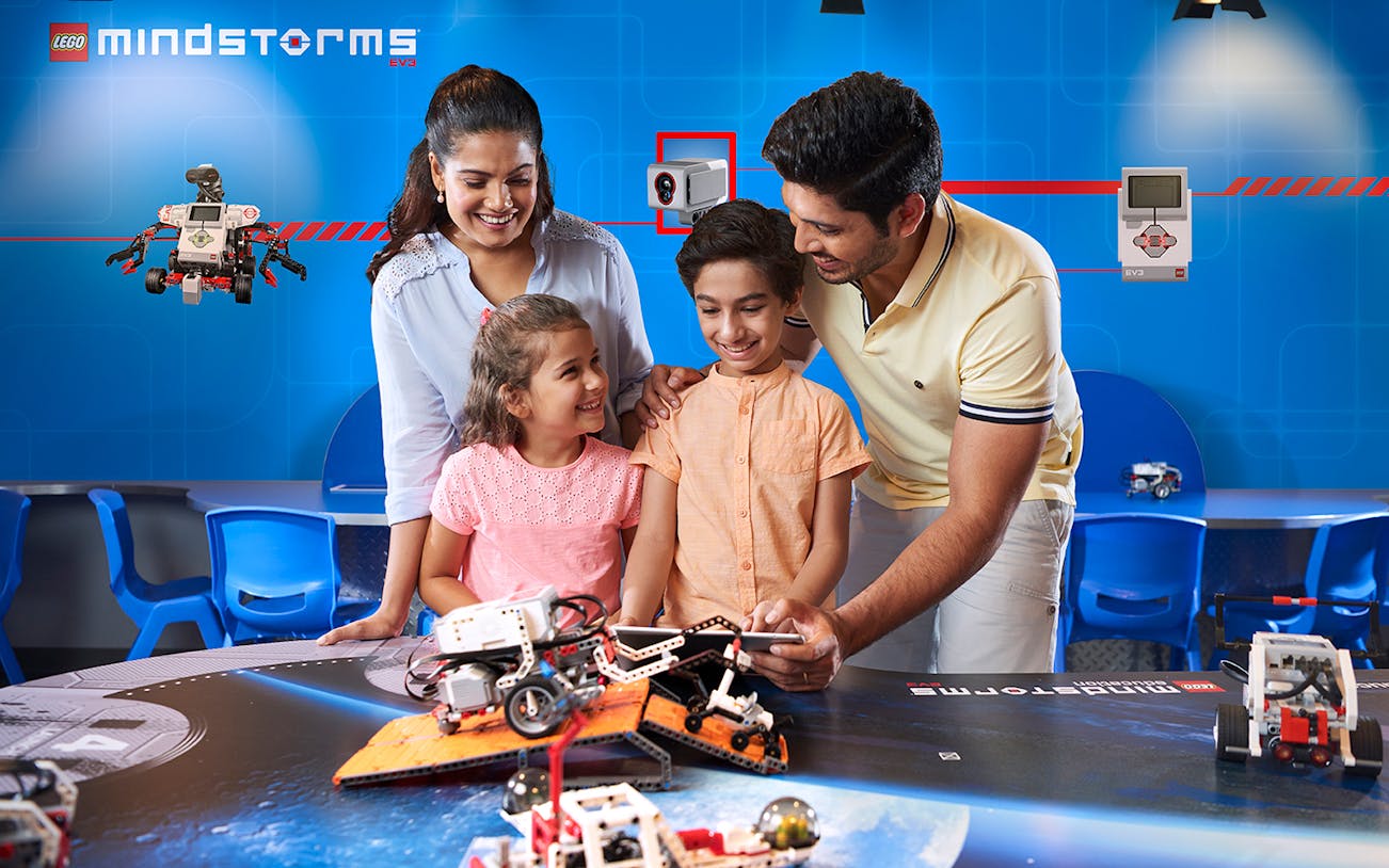 Family exploring robotics at Legoland Dubai.