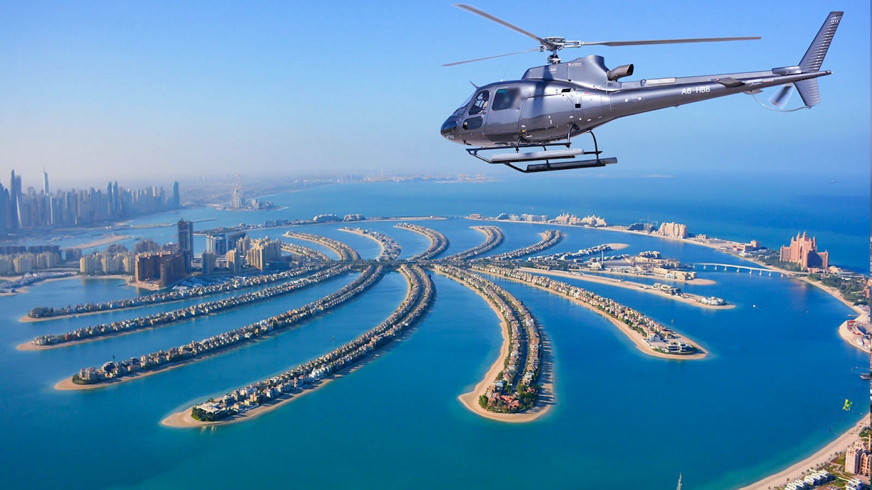 Helicopter flying over Palm Jumeirah, Dubai during Odyssey Helicopter Private Tour.