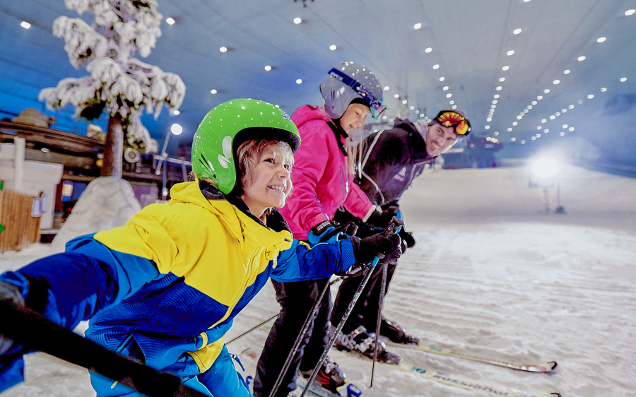 Skiers enjoying indoor slopes at Ski Dubai Snow Park.