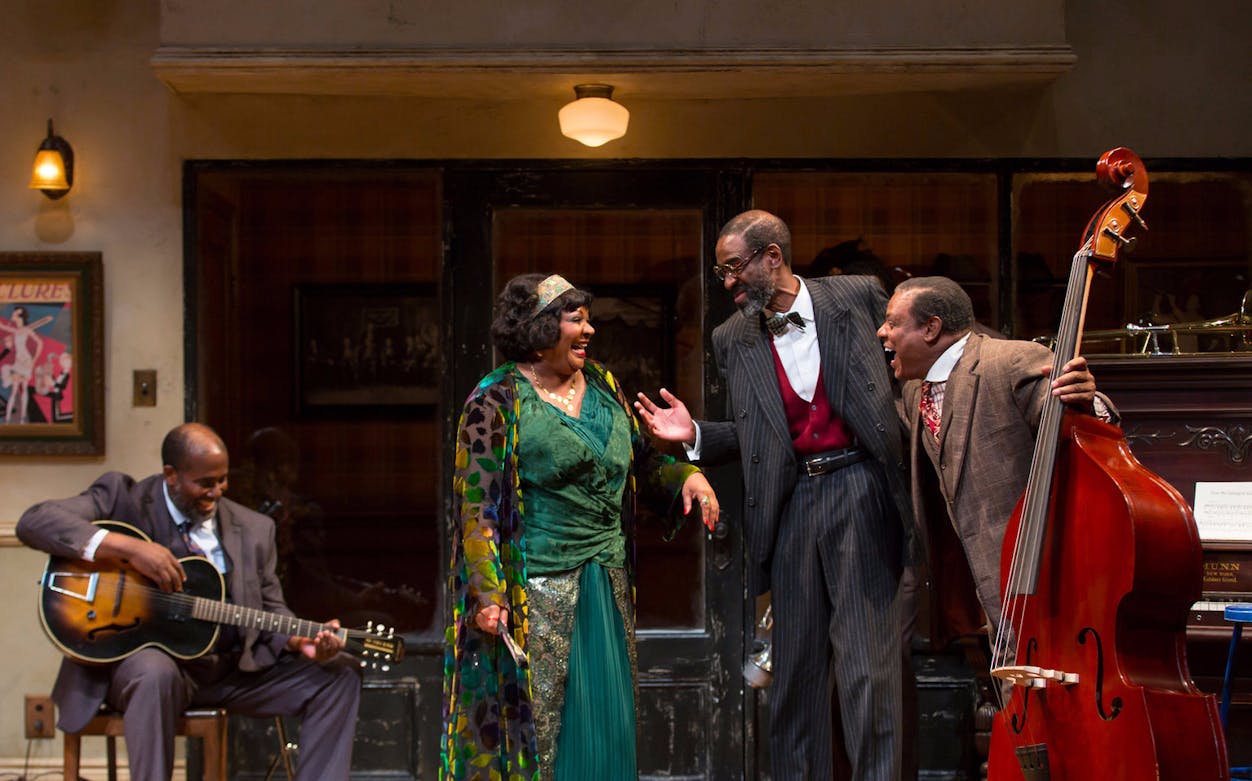 Musicians performing in a scene from Ma Rainey's Black Bottom on stage.