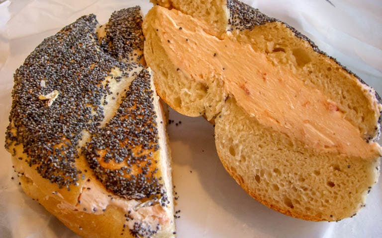 Poppy seed bagel with cream cheese, featured on The Great Food Tour of New York.
