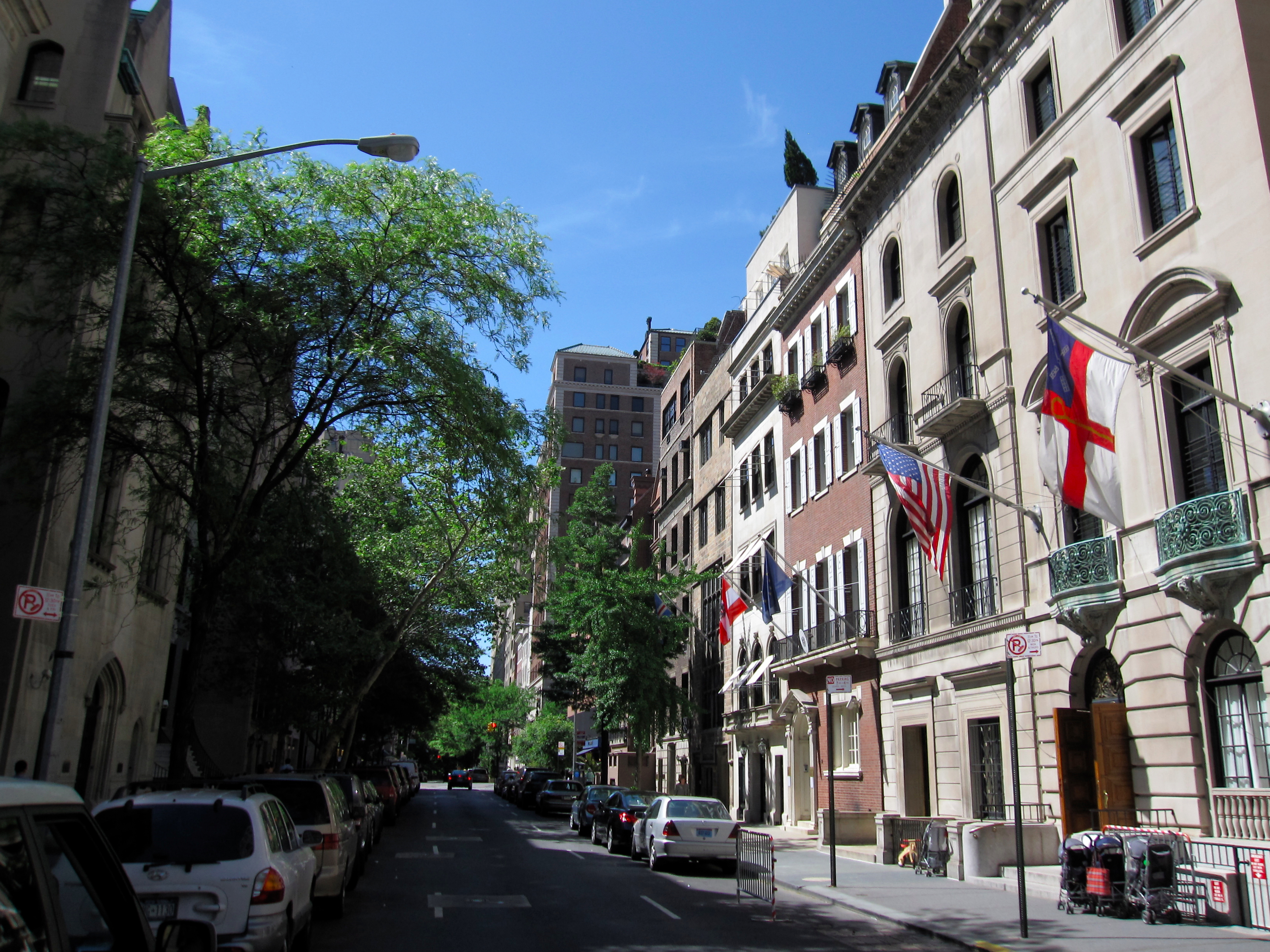 Historic New York street with flags, part of Immigrant New York Tour.