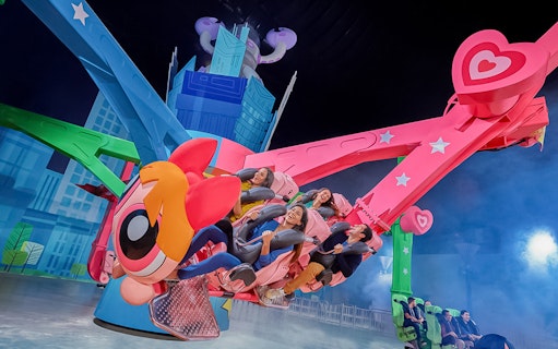 Visitors enjoying a themed ride at IMG Worlds of Adventure, Dubai.
