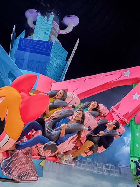 Visitors enjoying a themed ride at IMG Worlds of Adventure, Dubai.