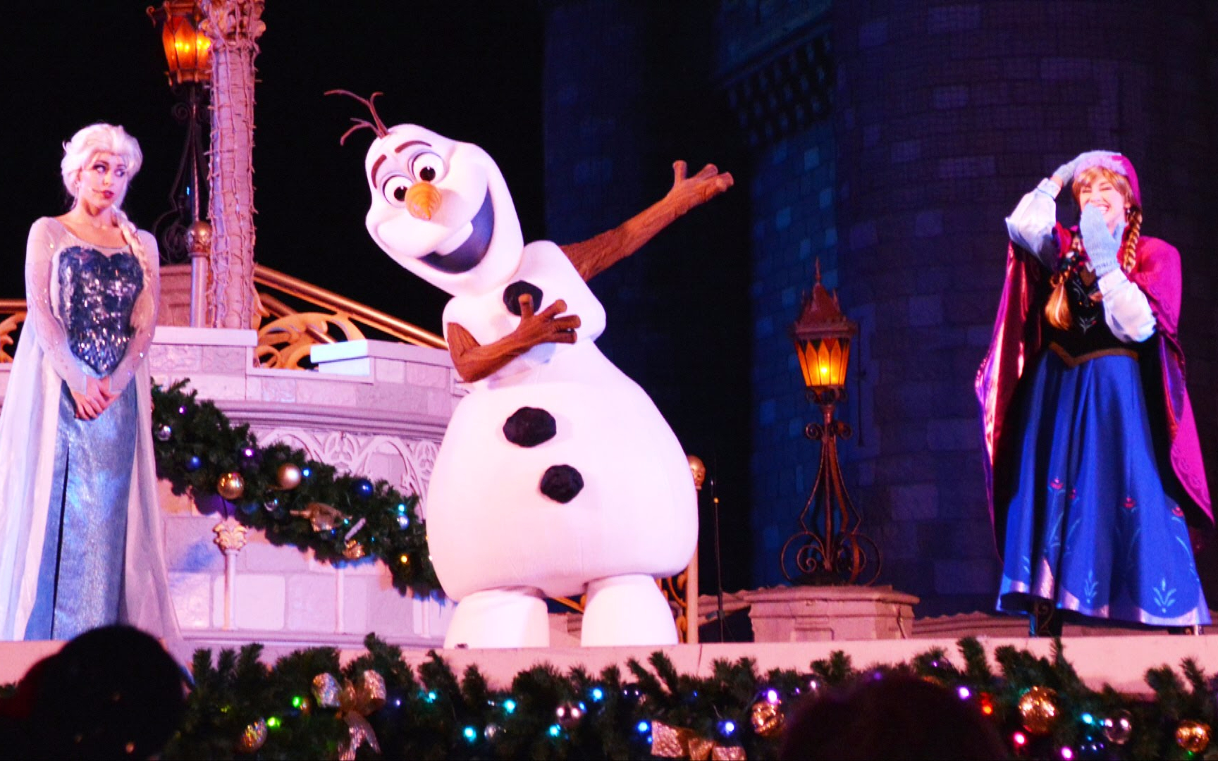 Characters from Frozen performing at Disney World stage.