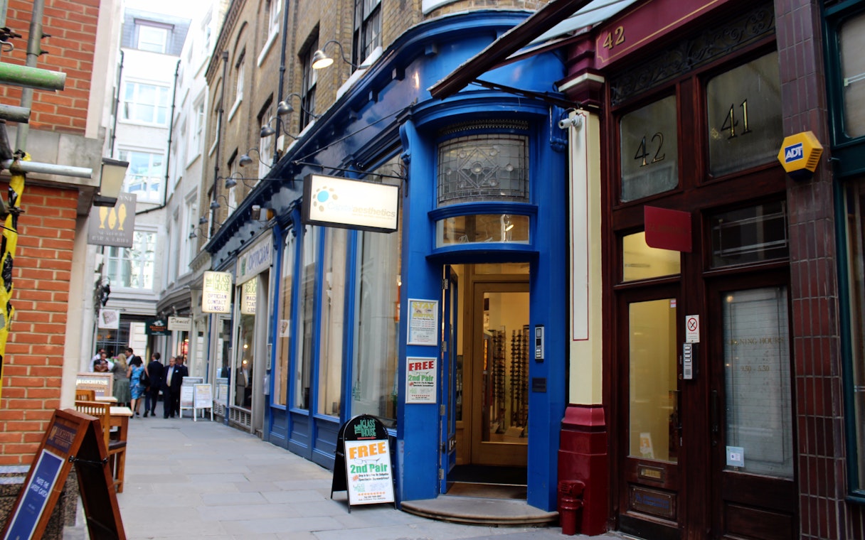 London alleyway with blue storefront, featured in Harry Potter film locations tour.