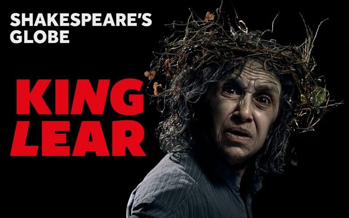 King Lear character with wild hair and intense expression at Shakespeare's Globe.
