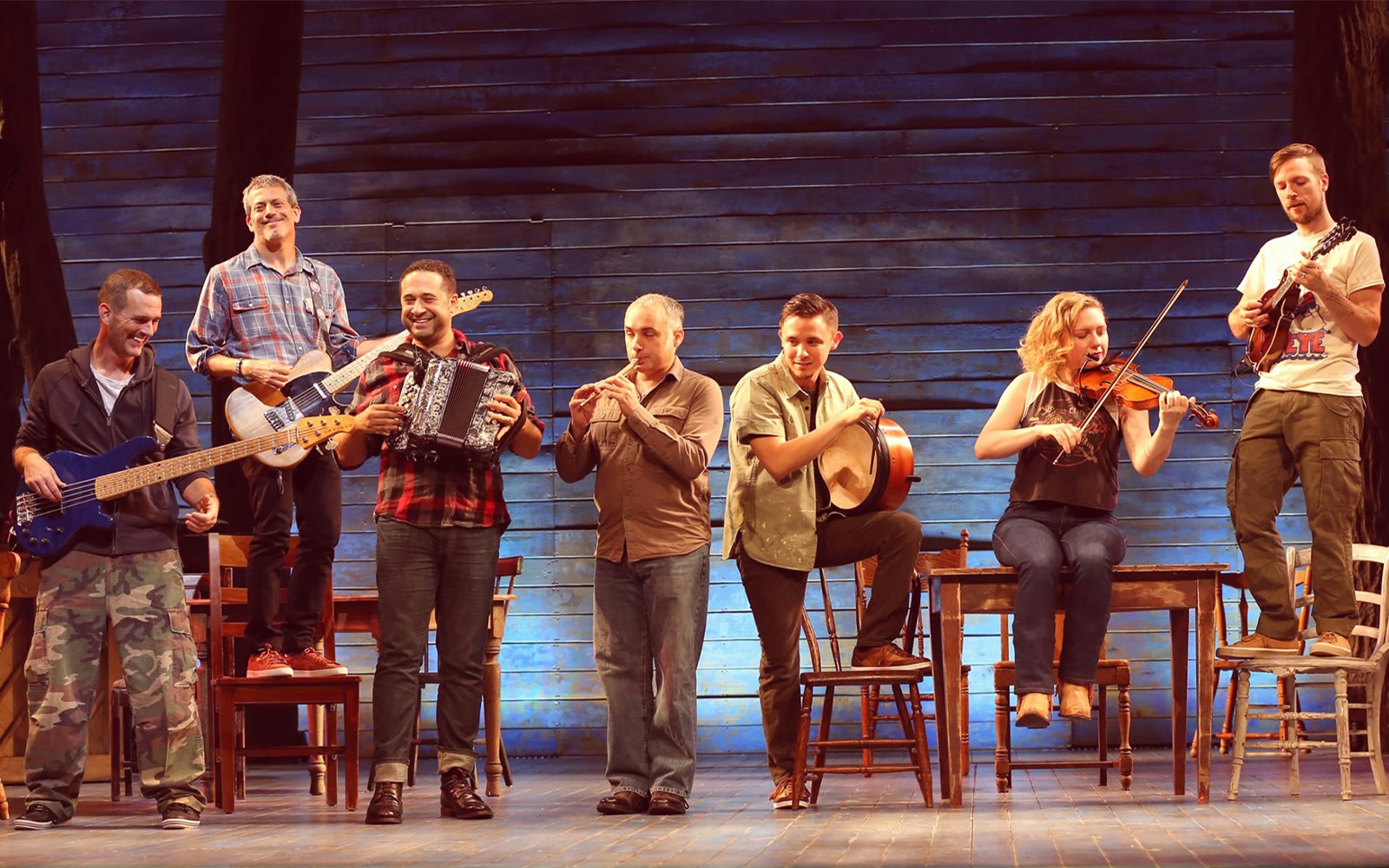 Musicians performing on stage in the musical "Come From Away.