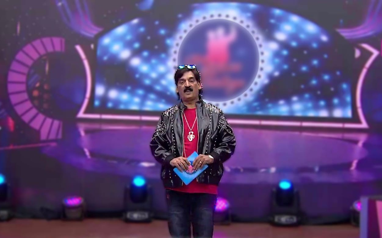 Comedian performing on stage during 'Budha Ghar Par Hai' comedy evening event.