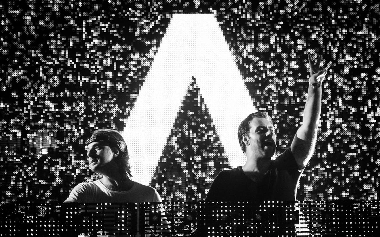 DJ duo performing at Envie Events NYE 2017 with illuminated backdrop.