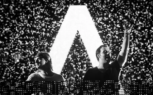 DJ duo performing at Envie Events NYE 2017 with illuminated backdrop.