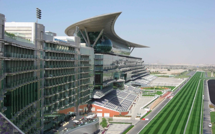 Meydan Racecourse grandstand and track in Dubai, UAE.