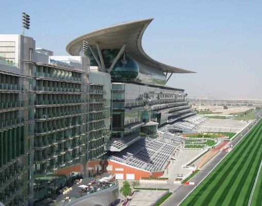 Meydan Racecourse grandstand and track in Dubai, UAE.