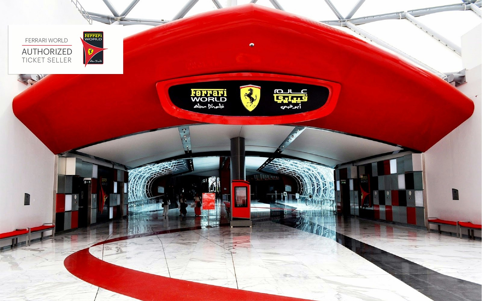 Entrance to Ferrari World Abu Dhabi with red and black signage, showcasing modern architecture.