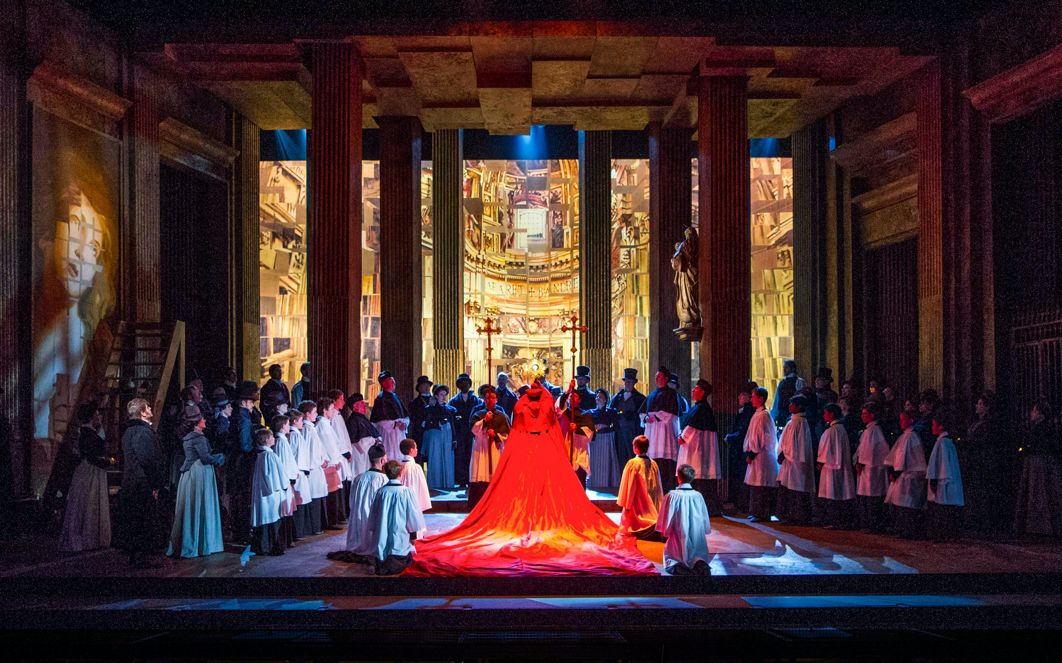 Royal Opera House stage with Tosca performance in London, featuring dramatic lighting and set design.