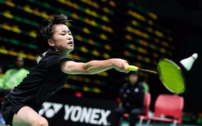 Badminton player in action at Dubai World Superseries Finals.