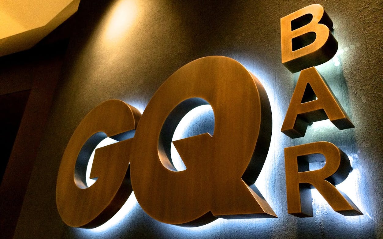 GQ Bar sign illuminated, venue for Fifty Shades of Gold: New Year's Eve Party.