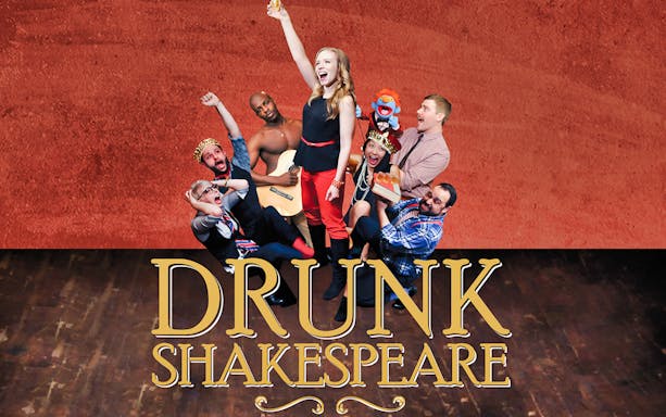 Actors performing Drunk Shakespeare with props and costumes on stage.