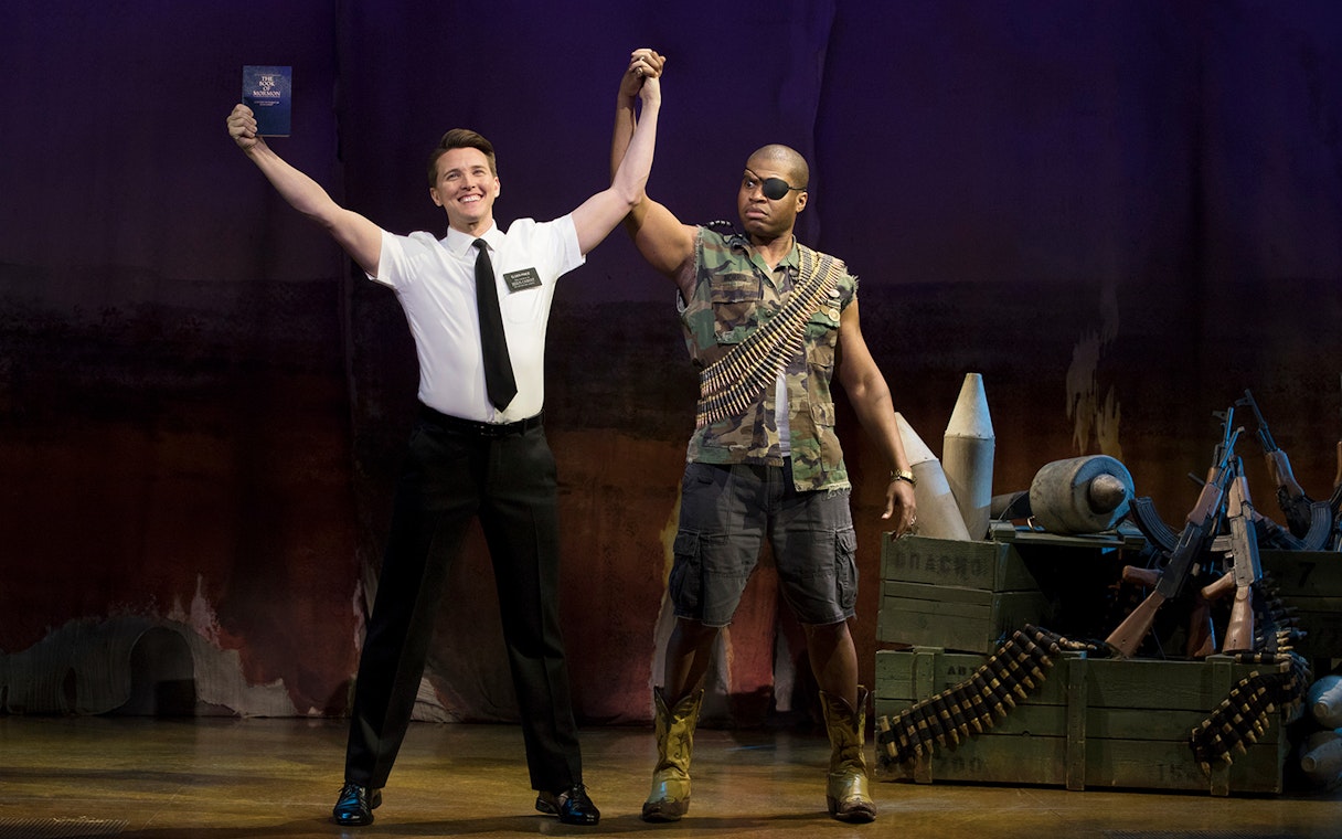 Performers on stage during "The Book of Mormon" musical.