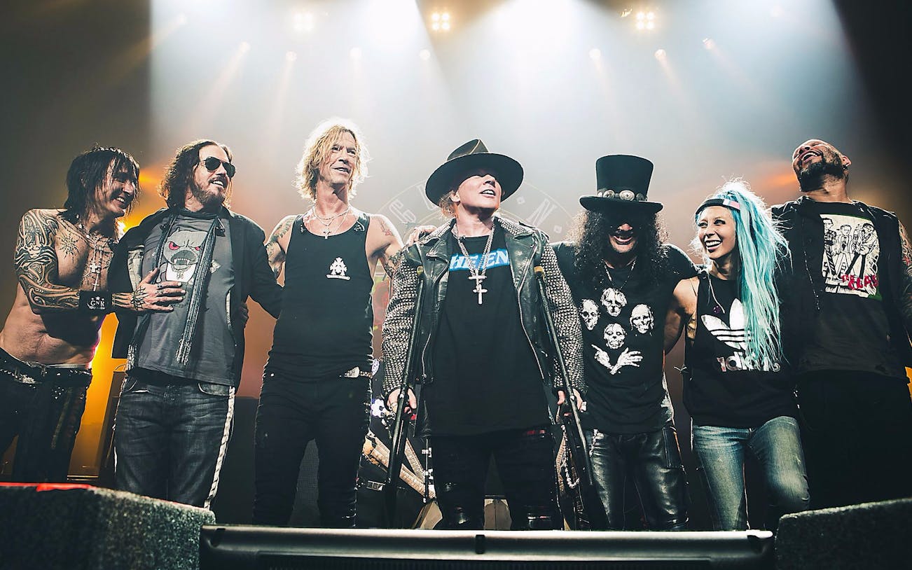 Band members on stage during Guns N' Roses live concert in Dubai.