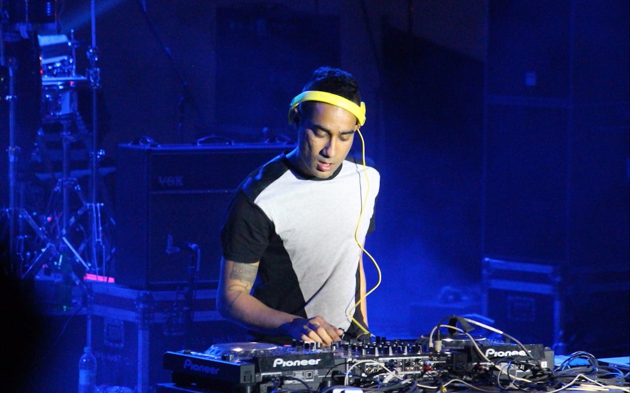 DJ performing live set at Nucleya concert in Dubai.